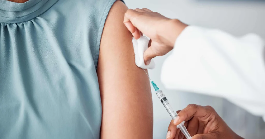Person receiving a Vitamin Shot in Webster, TX, from a healthcare professional